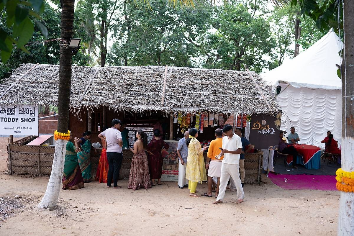 Guests gathered at the toddy shop set-up during a celebration