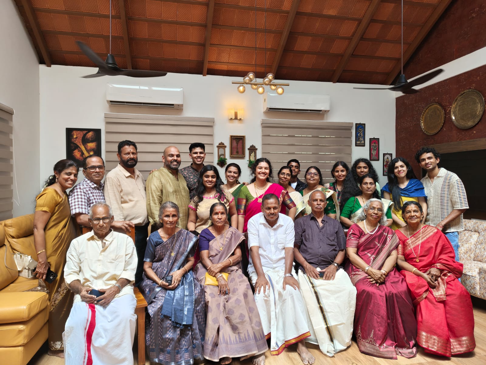 Extended family gathered together inside the Kalapura hall