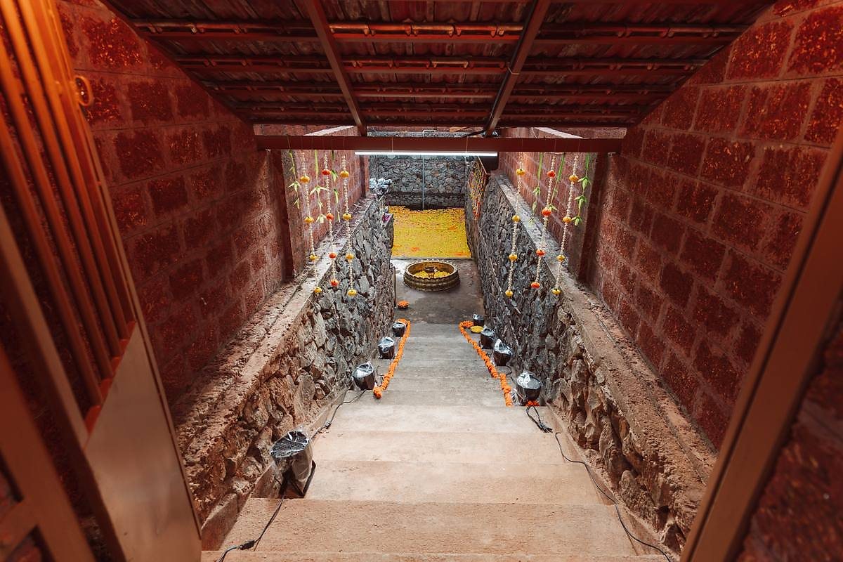 Stone stairway to the pond, decorated with marigolds and lamps