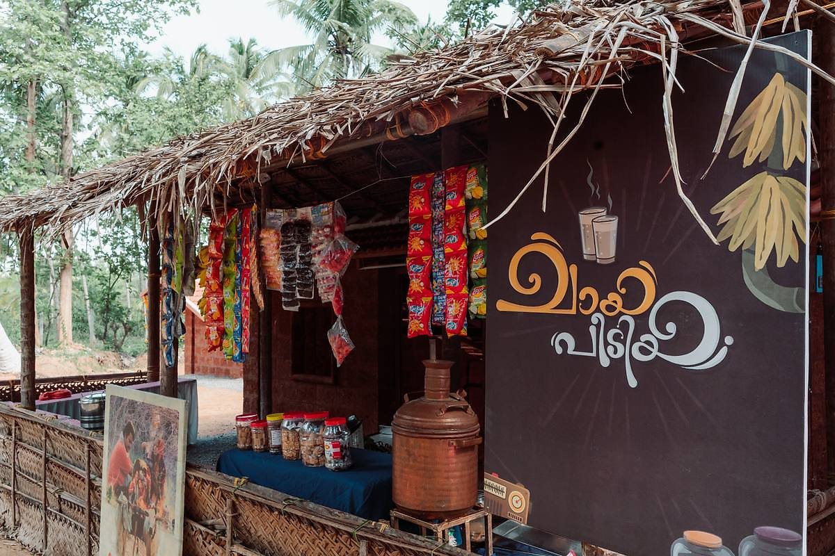 Traditional chai and snacks corner with thatched roof