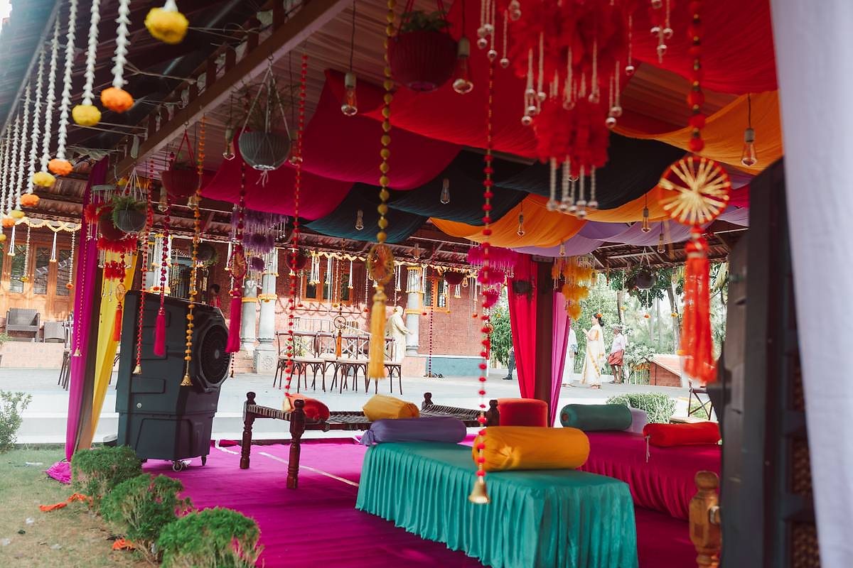 Mehendi seating with colourful drapes at Kalapura
