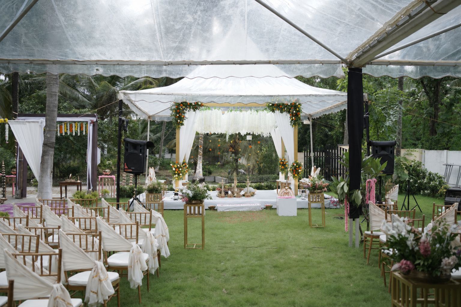 Open-air mandap and aisle set for a wedding at Kalapura